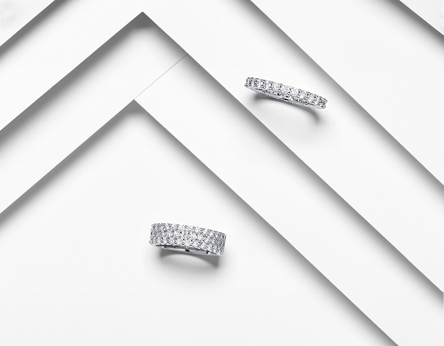 Birks diamond eternity bands on a white layered background. 